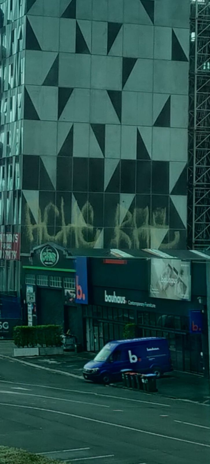 Large commercial building with graffatti on the outside of it in central Auckland.